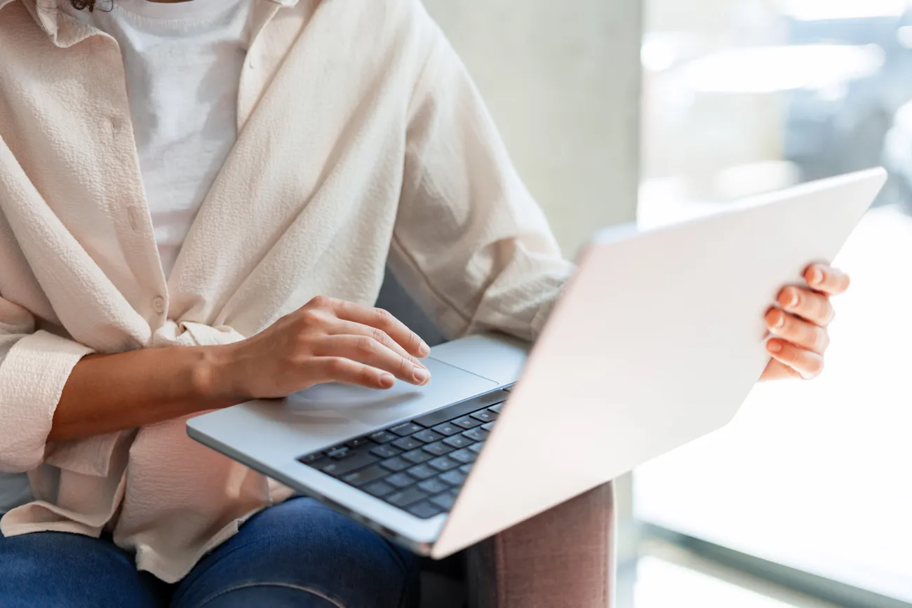 Woman reviewing results on a laptop during a telehealth visit
