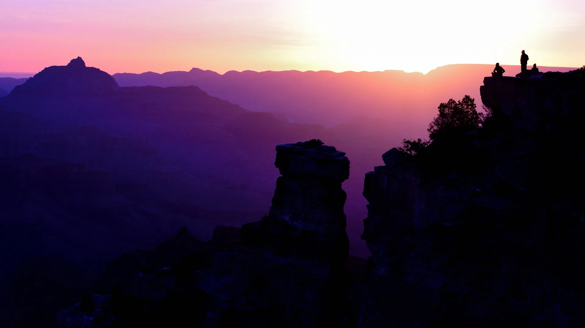 Man training outdoors at sunrise in mountain landscape